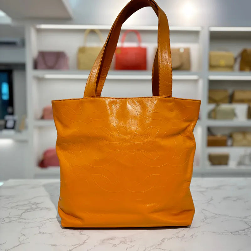 jw563-chanel-vintage-mustard-lambskin-cc-embossed-tote-bag