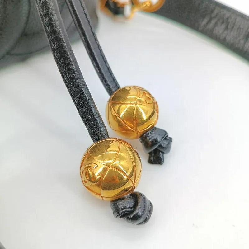 c457-chanel-vintage-black-caviar-leather-golden-ball-mini-bucket-bag