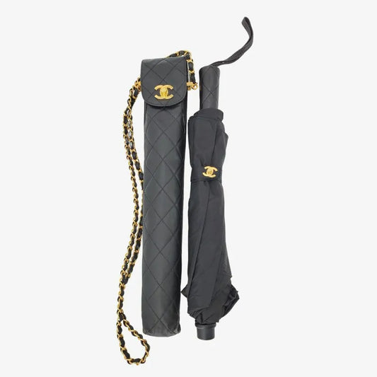 90196495-chanel-vintage-black-folding-umbrella-with-quilted-leather-case-gold-chain-cc