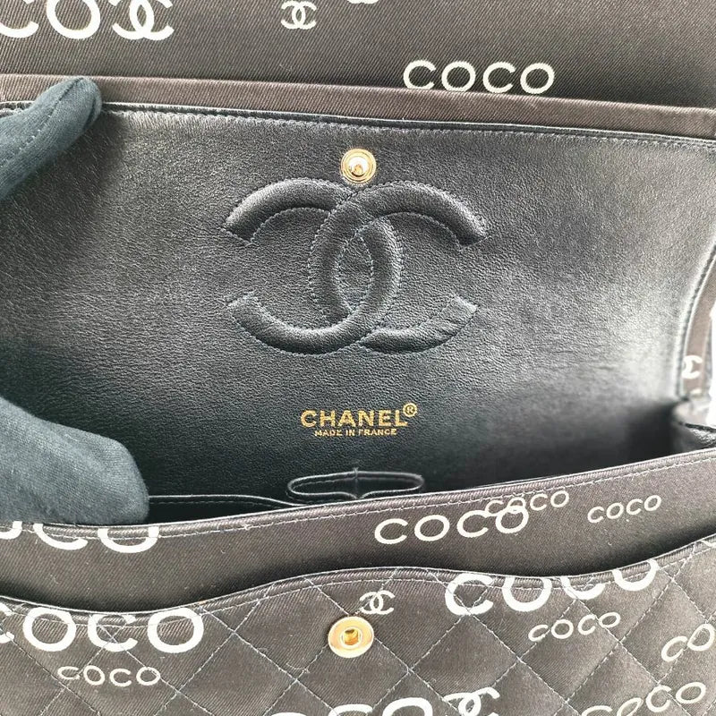 90173728-chanel-vintage-black-canvas-coco-print-flap-bag