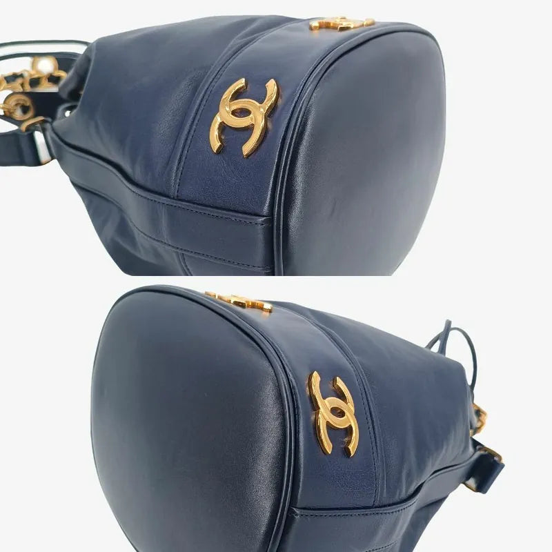 jah154-chanel-vintage-navy-lambskin-gold-ball-bucket-bag