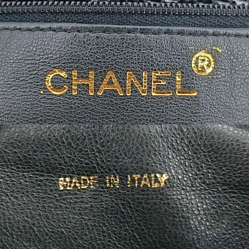 c389-chanel-vintage-black-lizard-skin-tassel-camera-bag