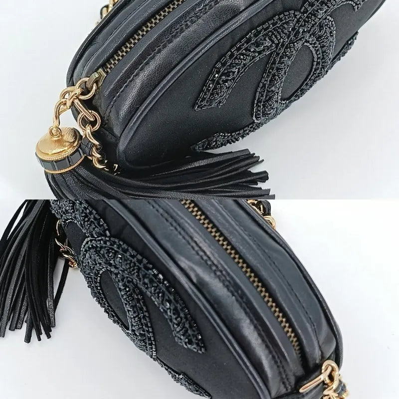 js561-chanel-vintage-black-satin-oval-camera-bag