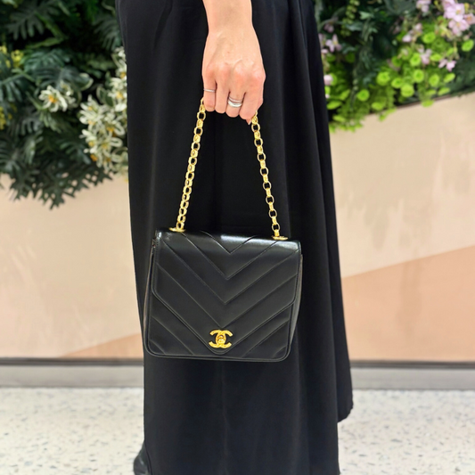 90273084 - CHANEL Vintage Black Lambskin Chevron Gold Chain Flap Bag